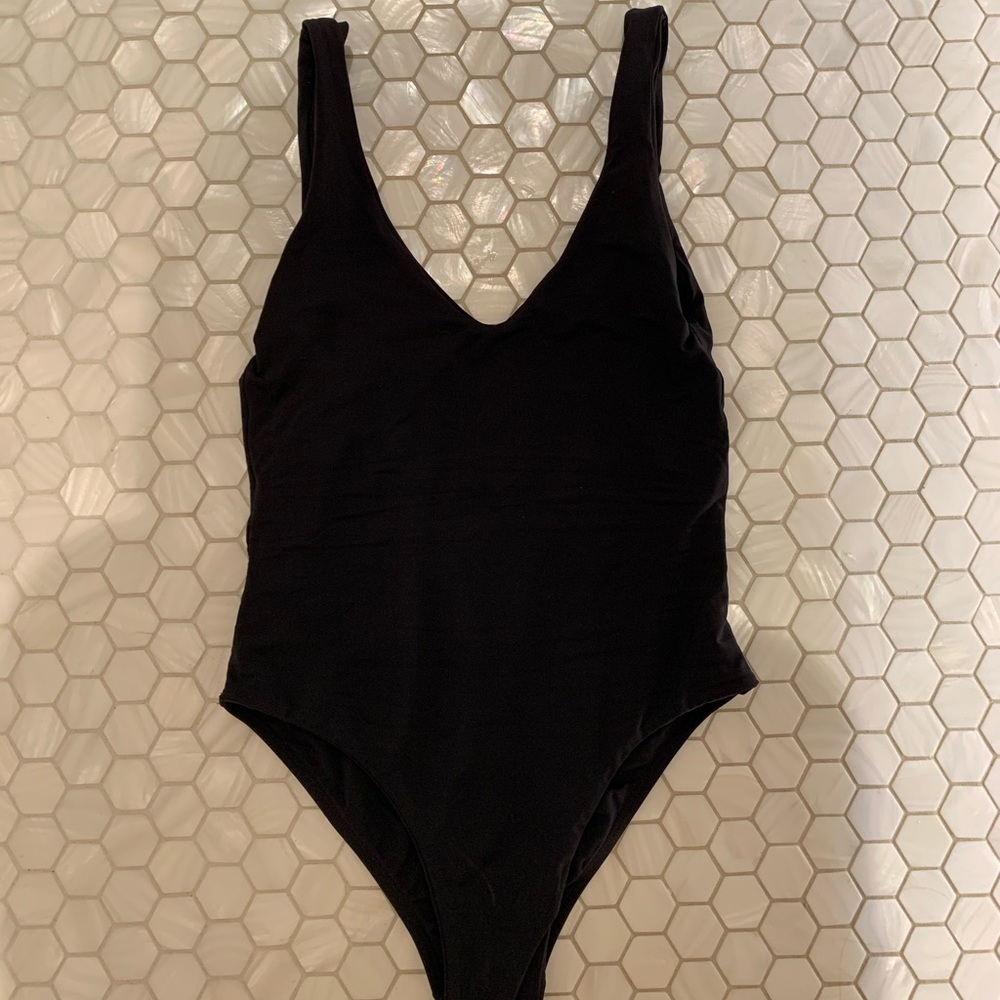 black one piece, low neck and back